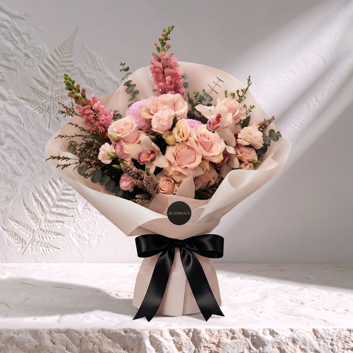 Bloomhaus Edit fresh flower bouquet with a black ribbon, featuring vibrant blooms and a stylish signature stone accent.