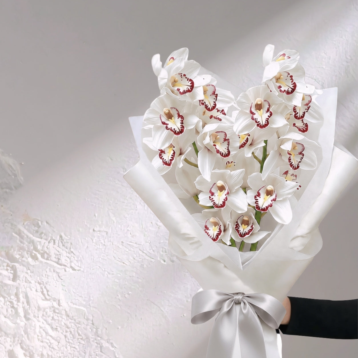 Bloomhaus Melbourne Cymbidium orchid flowers in vibrant bloom, showcasing elegant, colorful orchids in a floral arrangement.