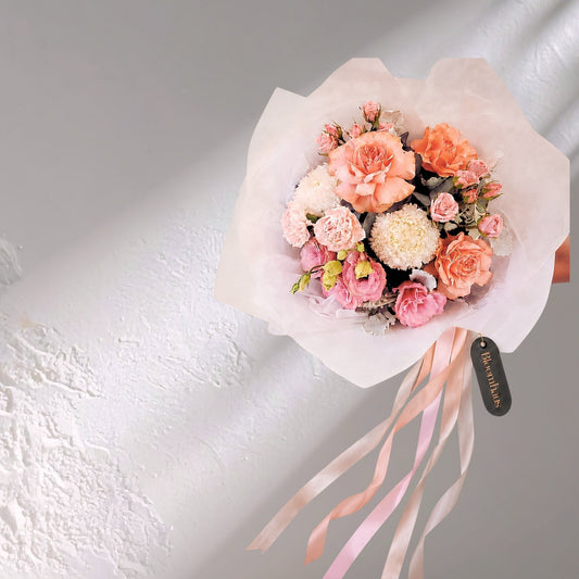 Blushing Blooms reflexed roses by BLOOMHAUS MELBOURNE featuring soft pink petals and lush green foliage.