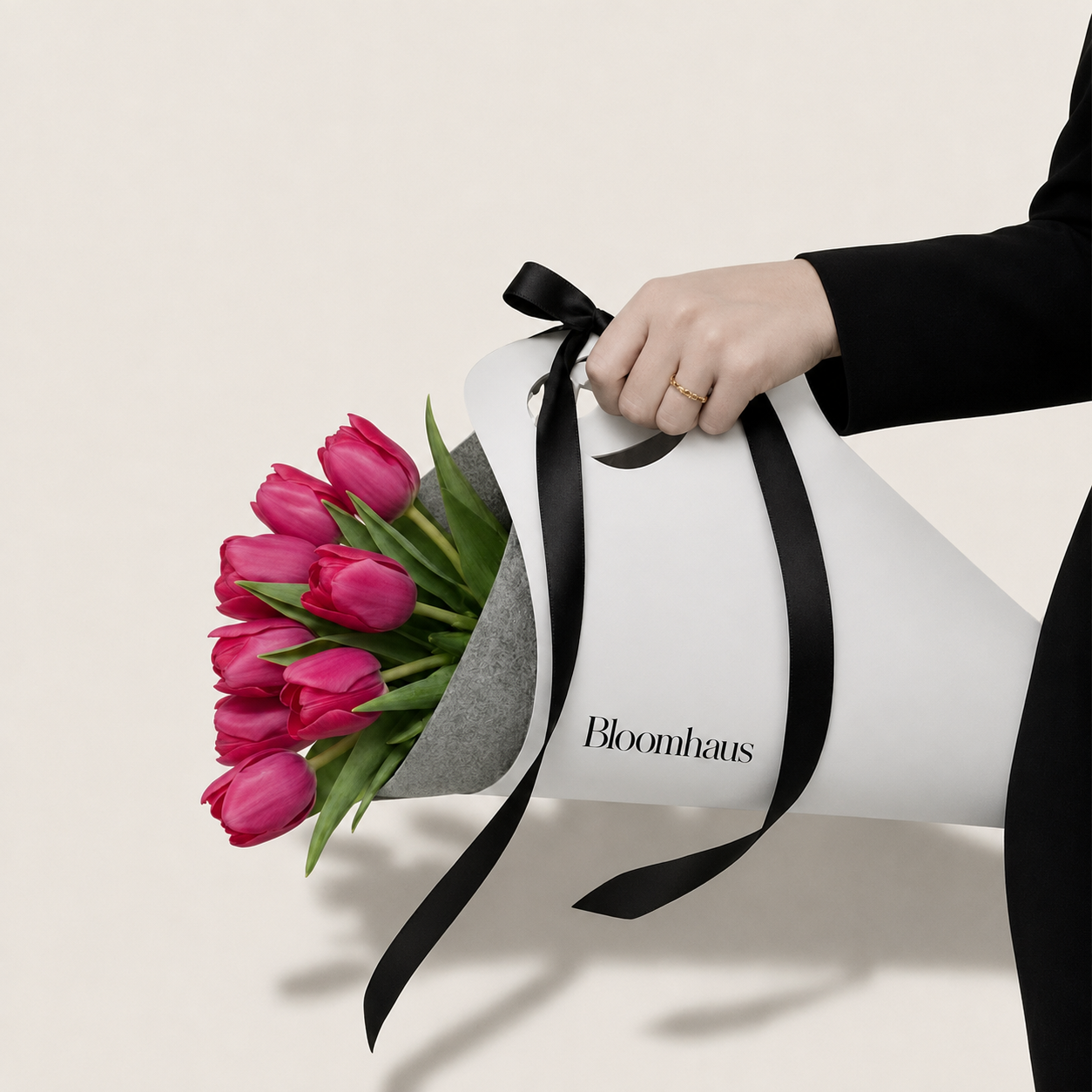 Bright pink tulips arranged in Bloomhaus Melbourne carrier, showcasing fresh, vibrant flowers in a natural setting.