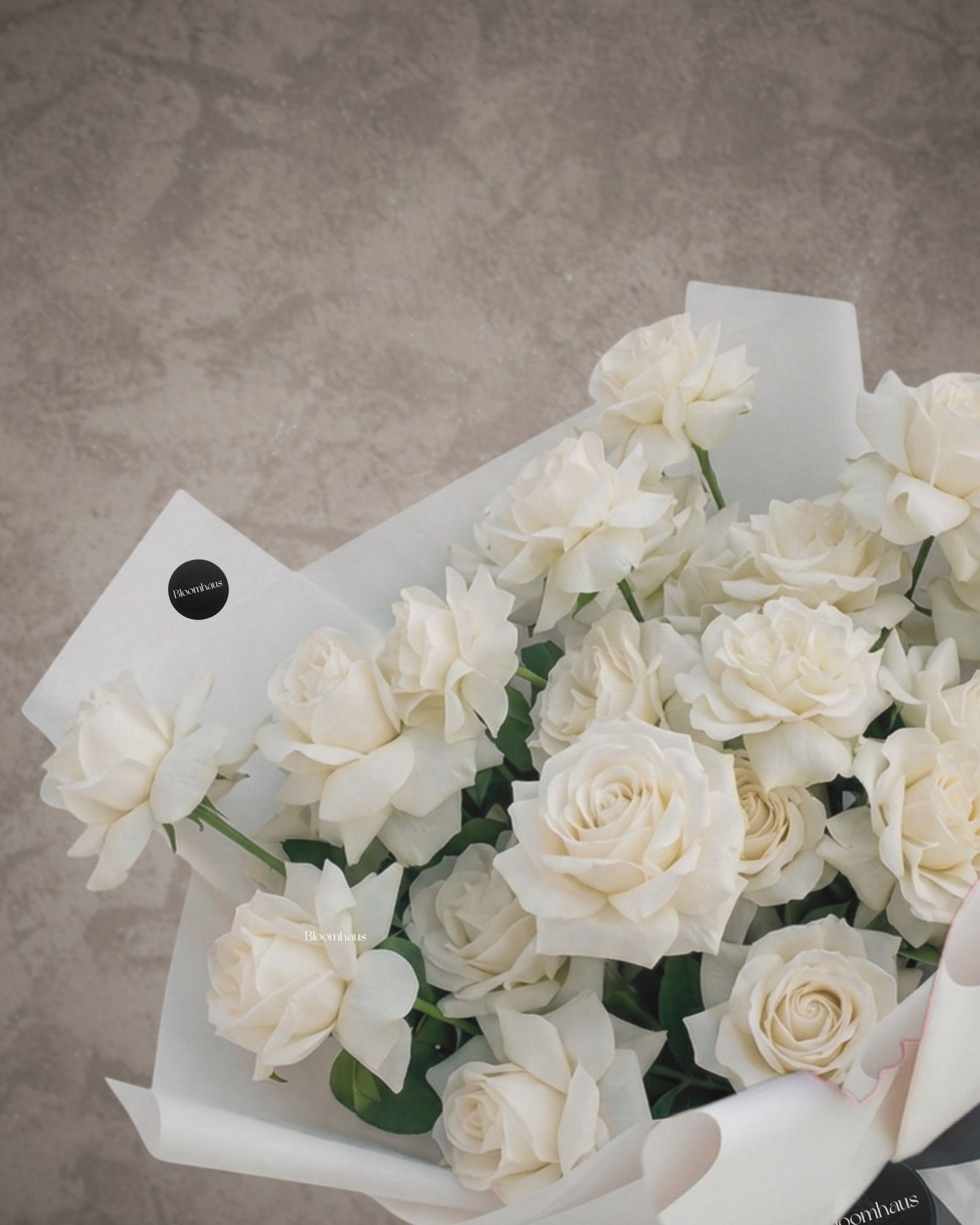 Bouquet of Ecuadorian reflexed roses from BLOOMHAUS MELBOURNE showcasing vibrant, tightly clustered red flowers.
