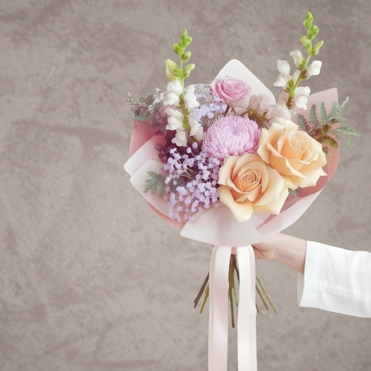 Fresh pastel roses and seasonal blooms from BLOOMHAUS MELBOURNE arranged in a bouquet with reflexed roses and vibrant colors.