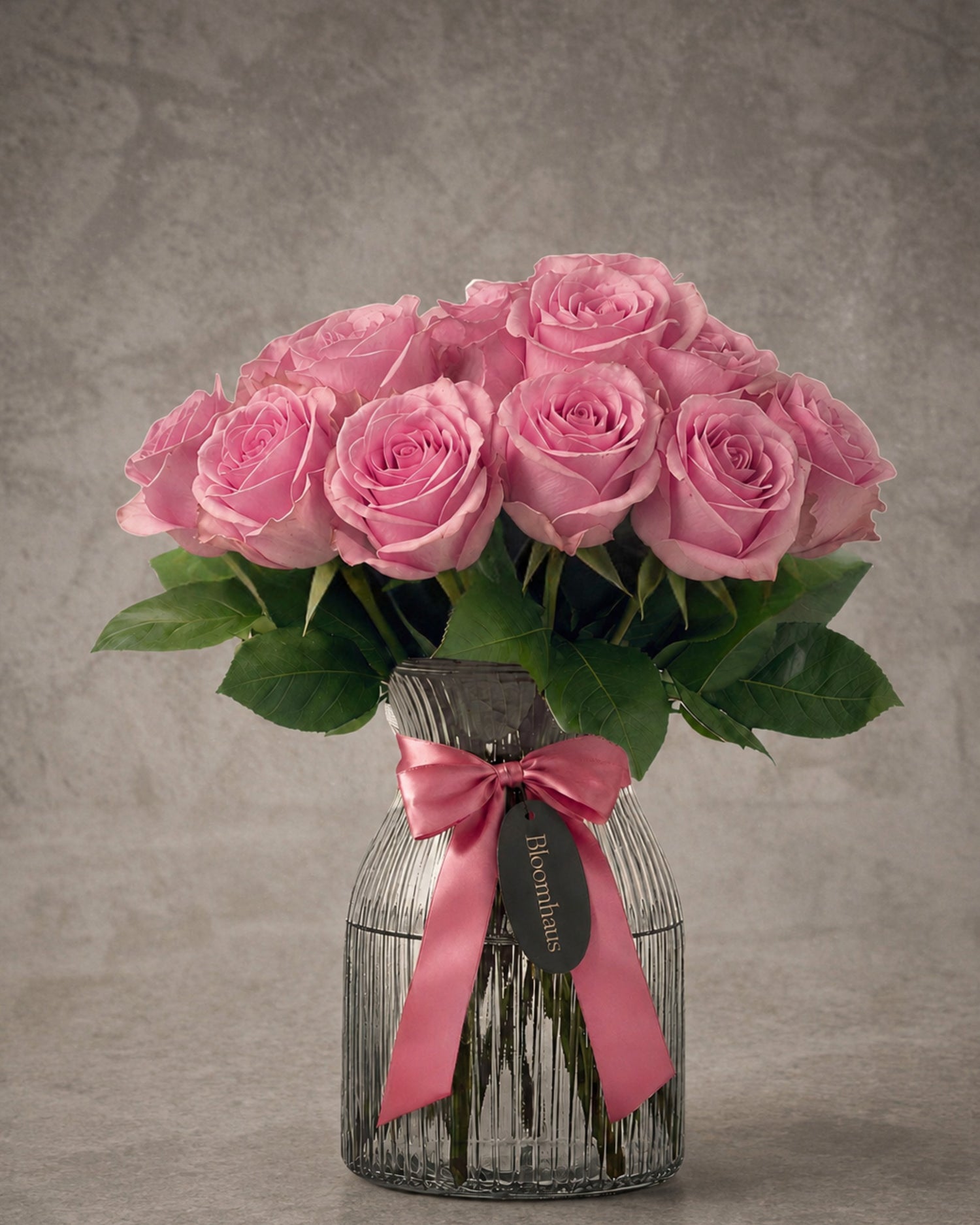 Pink rose bouquet arrangement in a clear vase featuring ten roses from Bloomhaus Melbourne, perfect for floral decor.