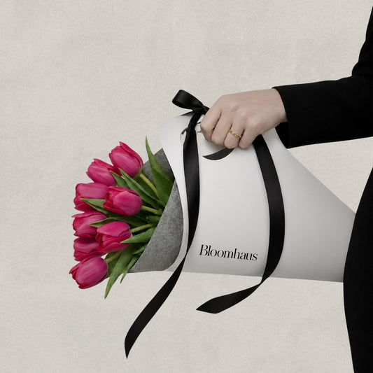 Colorful tulips in a Bloomhaus Melbourne carrier, showcasing vibrant blooms in a beautiful flower arrangement.