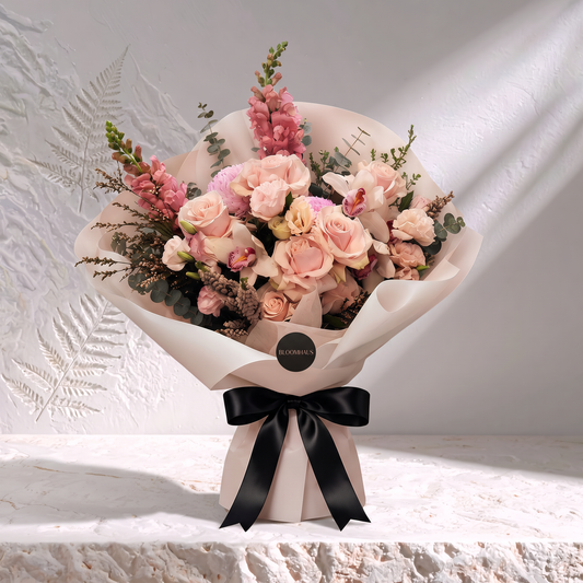 Bloomhaus Edit fresh flower bouquet with a black ribbon, featuring vibrant blooms and a stylish signature stone accent.