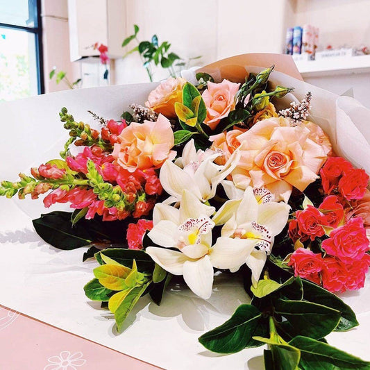 BLOOMHAUS MELBOURNE Flower arrangement Dolce Vita- Cymbidium, Reflexed roses and Snapdragons Sheath arrangement
