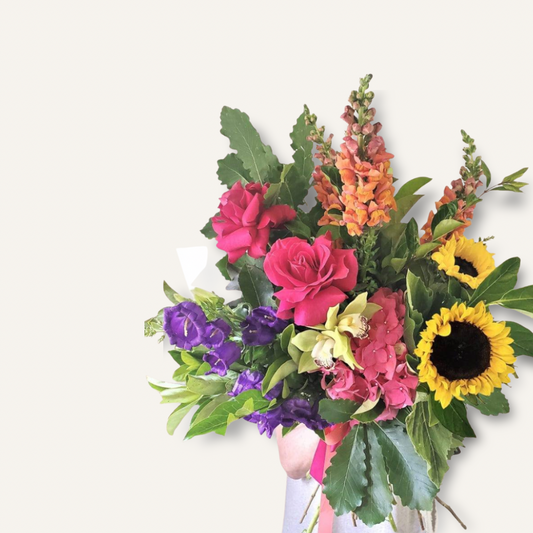 Vibrant Flower Bomb bouquet by BLOOMHAUS MELBOURNE featuring colorful, fresh flowers arranged in a lively bouquet.
