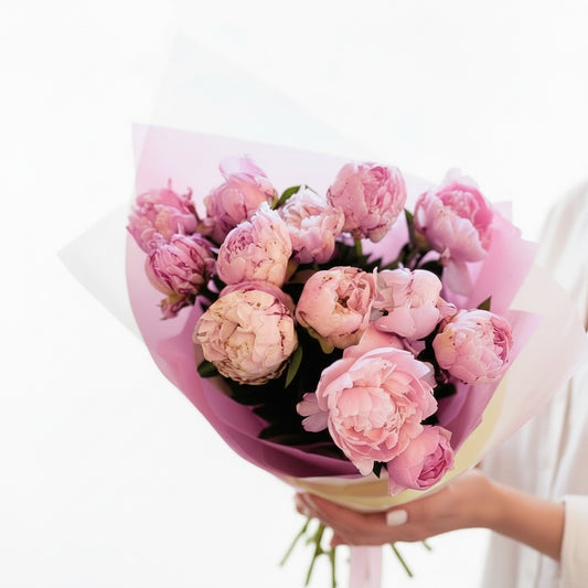 Bright pink peonies in a lush bouquet, showcasing large, ruffled petals from Bloomhaus Melbourne's premium seasonal flower collection.