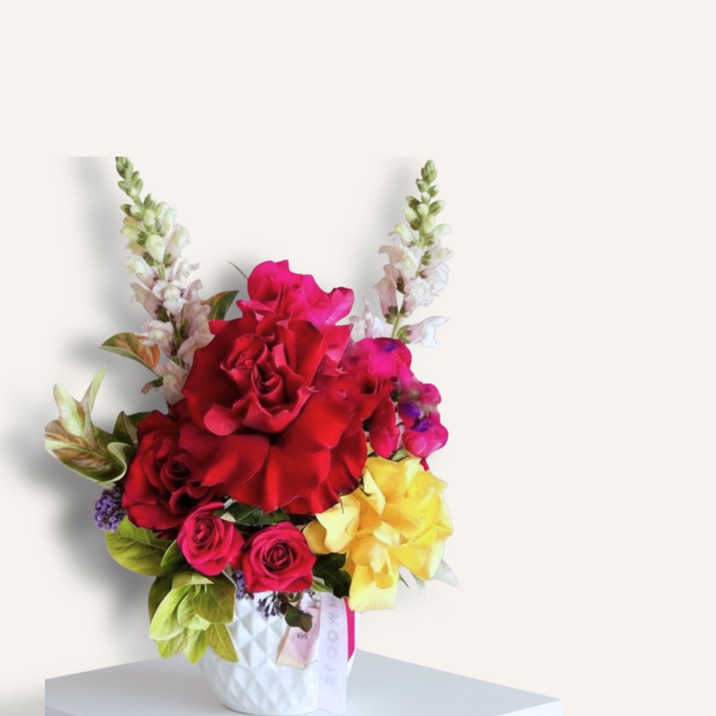 Bright roses in a ceramic pot inspired by Frida Kahlo, featuring vibrant flowers and artistic design, from Bloomhaus Melbourne.