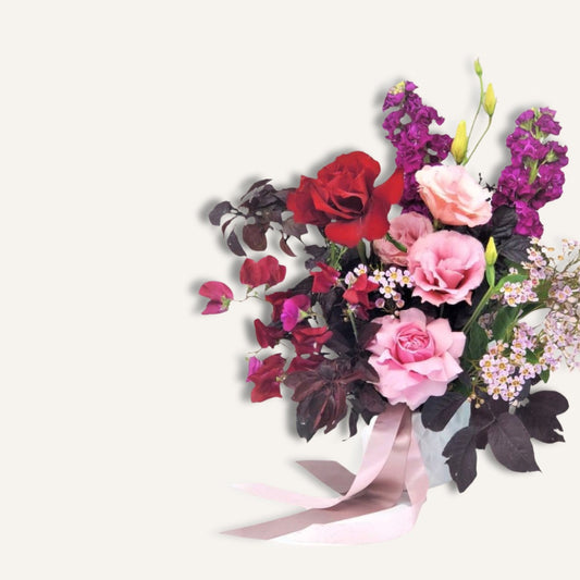 Sweet pink and red roses with seasonal blooms in a bouquet from BLOOMHAUS MELBOURNE, perfect for expressing love and affection.
