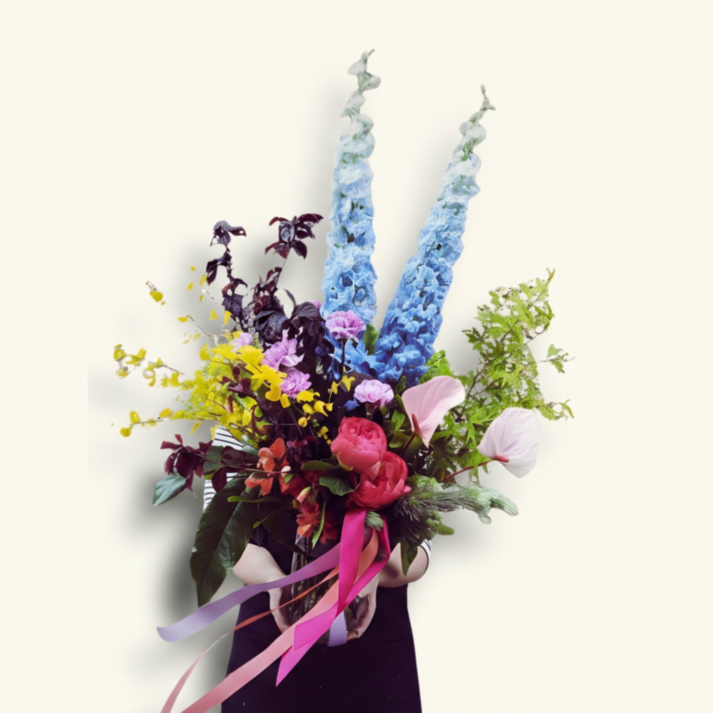 Fresh bespoke floral arrangement in a clear vase featuring colorful blooms from BLOOMHAUS MELBOURNE, perfect for home or occasion decor.