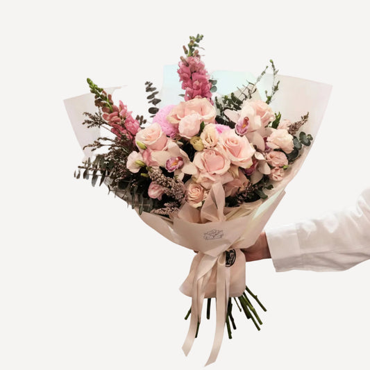 Fresh flower bouquet by BLOOMHAUS MELBOURNE featuring colorful mixed blooms arranged in a vibrant bouquet.
