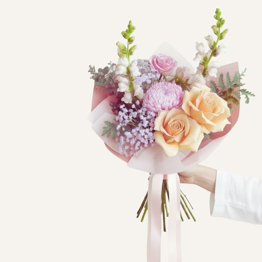 Bouquet of flowers with pink and yellow roses on a white background bloomhaus melbourne flower delivery
