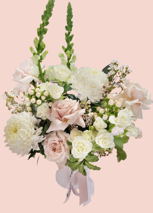 Angel| White and Blush reflexed roses with seasonal blooms and babies breath in a ceramic pot