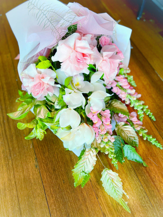 BLOOMHAUS MELBOURNE Flower arrangement Enchantress - A sheath of Premium Reflexed Roses, Cymbidium Orchid, Snapdragons & Seasonal Blooms